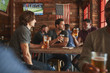 © Monkey Business - Group Of Male Friends Meeting And Drinking Beer In Sports Bar Together