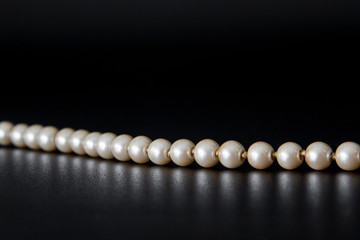 Pearls on black background