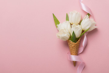 Wall Mural - Flat-lay waffle cone with white flower blossom