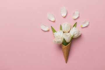 Wall Mural - Flat-lay waffle cone with white flower blossom