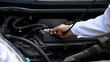 © motortion - Examination of automobile with stethoscope, concept of qualified car diagnostics