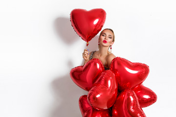 Valentine Beauty girl with red balloon holding hands, isolated on background. Beautiful Happy Young woman sends a kiss. Holiday party, birthday. Joyful model - Image