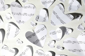 Sticker - Paper hearts with music notes on white wooden background, flat lay