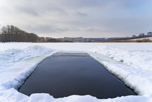 Ice Hole In The Winter Lake