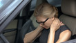 © motortion - Exhausted woman feeling neck pain, sitting in automobile, spinal problem, health