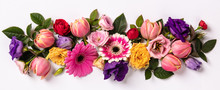 Creative Layout Made With Beautiful Flowers On White Background.