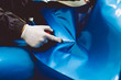 © hedgehog94 - Car wrapping specialist putting vinyl foil or film on car. Selective focus.
