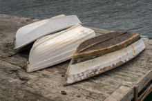 Overturned Rowboats On Dock