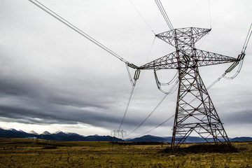 electricity pylons in field