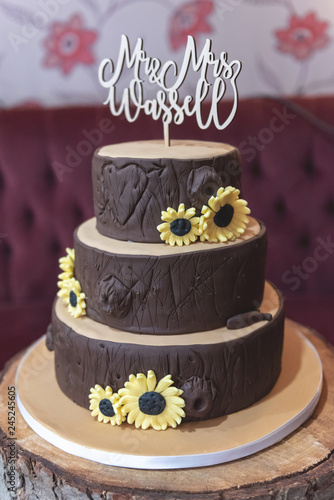 Wood Effect Wedding Cake With Sunflower Decoration And Mr And Mrs
