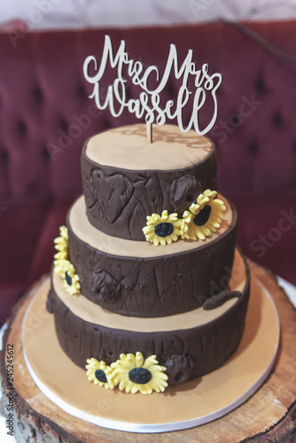 Wood Effect Wedding Cake With Sunflower Decoration And Mr And Mrs