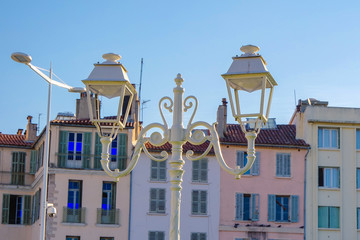 Street white iron lamp post with two led lamp on building backgrounds, Toulon, France