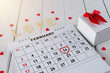 © sirastock - Calendar page with a red hand written heart highlight on February 14 of Saint Valentines day