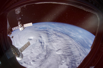 Wall Mural - hurricane is seen from spaceship porthole. the elements of this image furnished by nasa.