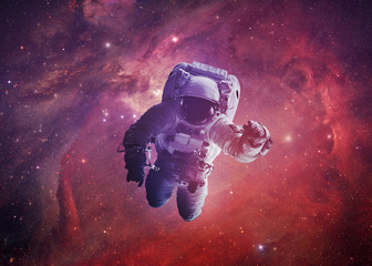astronaut afloat - elements of this image furnished by nasa