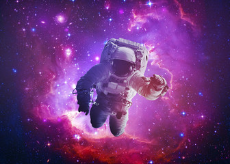 Wall Mural - astronaut afloat - elements of this image furnished by nasa