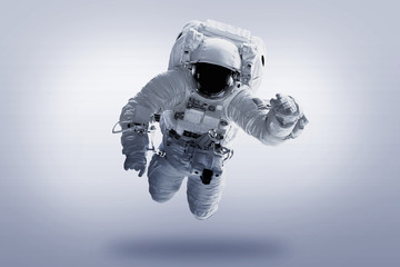 Wall Mural - astronaut afloat - elements of this image furnished by nasa