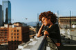 © Rawpixel.com - Girl with curly hair at a LA rooftop