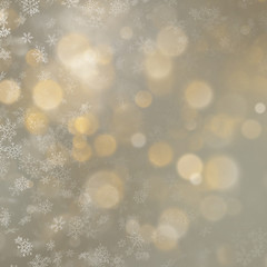 Christmas defocused blurred gold background with showflakes. EPS 10