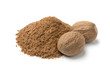 Heap of ground nutmeg and whole nutmeg seeds