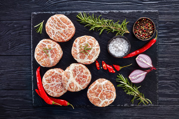 uncooked Atriaux, ground pork wrapped in caul fat