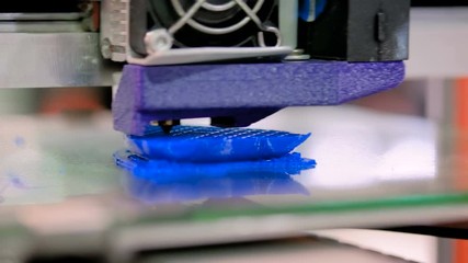 Automatic three dimensional 3D printer machine printing plastic model at modern technology exhibition. 3D printing, additive technologies, 4.0 industrial revolution and futuristic concept