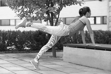 Wall Mural - strong athletic girl holds a workout