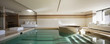 © alexandre zveiger - Indoor pool of private villa with lake view and bar area