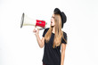 © dianagrytsku - Attractive young woman in floppy hat with megaphone isolated on white background