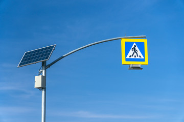 Wall Mural - street lighting, supports for ceilings with led lamps. concept of modernization and maintenance of lamps, place for text, day, road sign. crosswalk. a solar panel