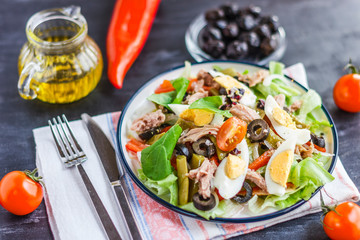 Wall Mural - Nicoise salad with tuna, green beans, basil and fresh vegetables