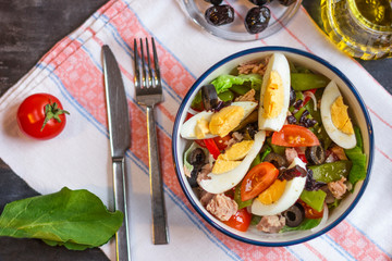 Wall Mural - Nicoise salad with tuna, green beans, basil and fresh vegetables