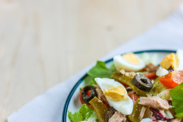 Wall Mural - Nicoise salad with tuna, green beans, basil and fresh vegetables