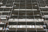 Fototapeta Kwiaty - new building under construction, scaffolding and concrete