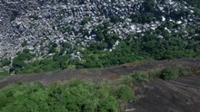 Favela Aerials: Tilting Up From Forest To Reveal Rocinha Favela, Rio De Janeiro, Brazil