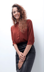 Wall Mural - young woman leaning on a white screen