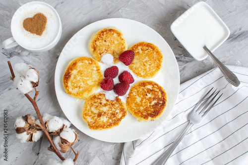 White Cup Of Coffee Cappuccino With Heart Pattern Of Cinnamon