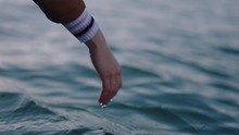 Close Up Woman Hand Touching Water Waves Splashing Tourist Enjoying Boat Ride