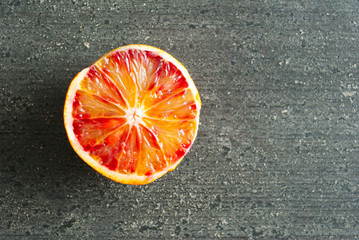 Wall Mural - peeled blood oranges on dark wood table