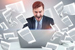 © ImageFlow - Shouting businessman with laptop, documents