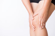© Siam - Runner sport knee injury. Closeup young woman in knee pain while running. Healthcare and medical concept.