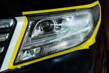 Closeup Car Lamp Or Front Headlight Polishing