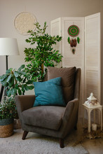 Green Dream Catcher In Interior On White Folding Screen. Living Room Decor
