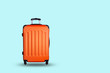 Travel suitcase on blue background