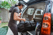© Odua Images - portrait of asian man with own luggage ready to go