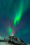 Fototapeta Kosmos - Northern Lights illuminates the sky with mountains of Norway