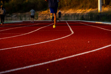 Red Running Track With Runner's Feet. Sport Stadium For Run.