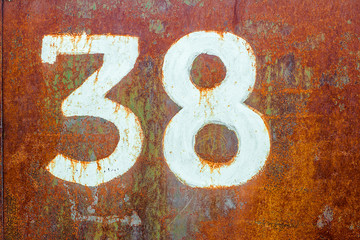 Wall Mural - Texture of old completely rusty metal with number theerty eight drawn by white paint