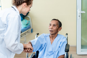 Senior man and doctor helping hands ,explaining diagnosis to his male patient  in medical office at hospital/ clinic .Elderly care medicine, age, health care, cardiology and people concept