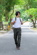 © PRASERT - male tourist in the park. Tourism and travel concept, cargo pants